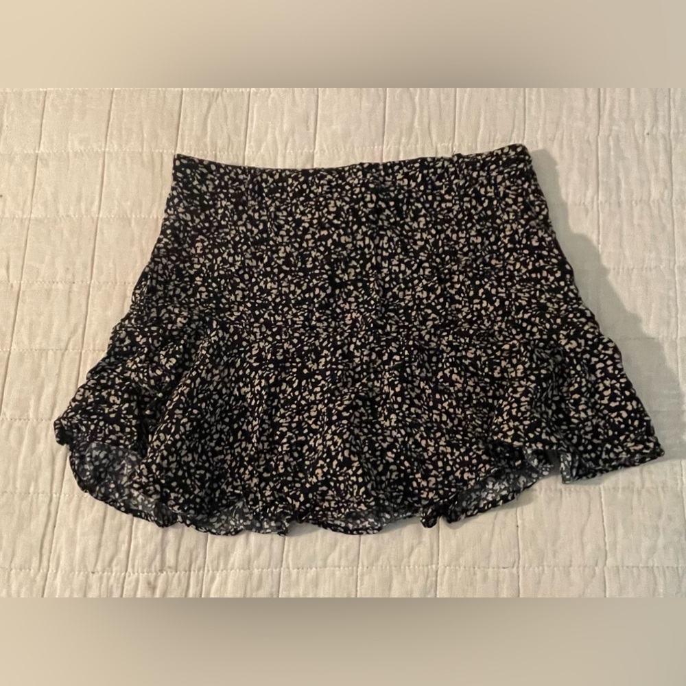 Black and tan floral mid-waisted mini skirt.